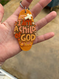 Orange’ child of God’ keychain