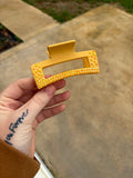 Yellow claw clip